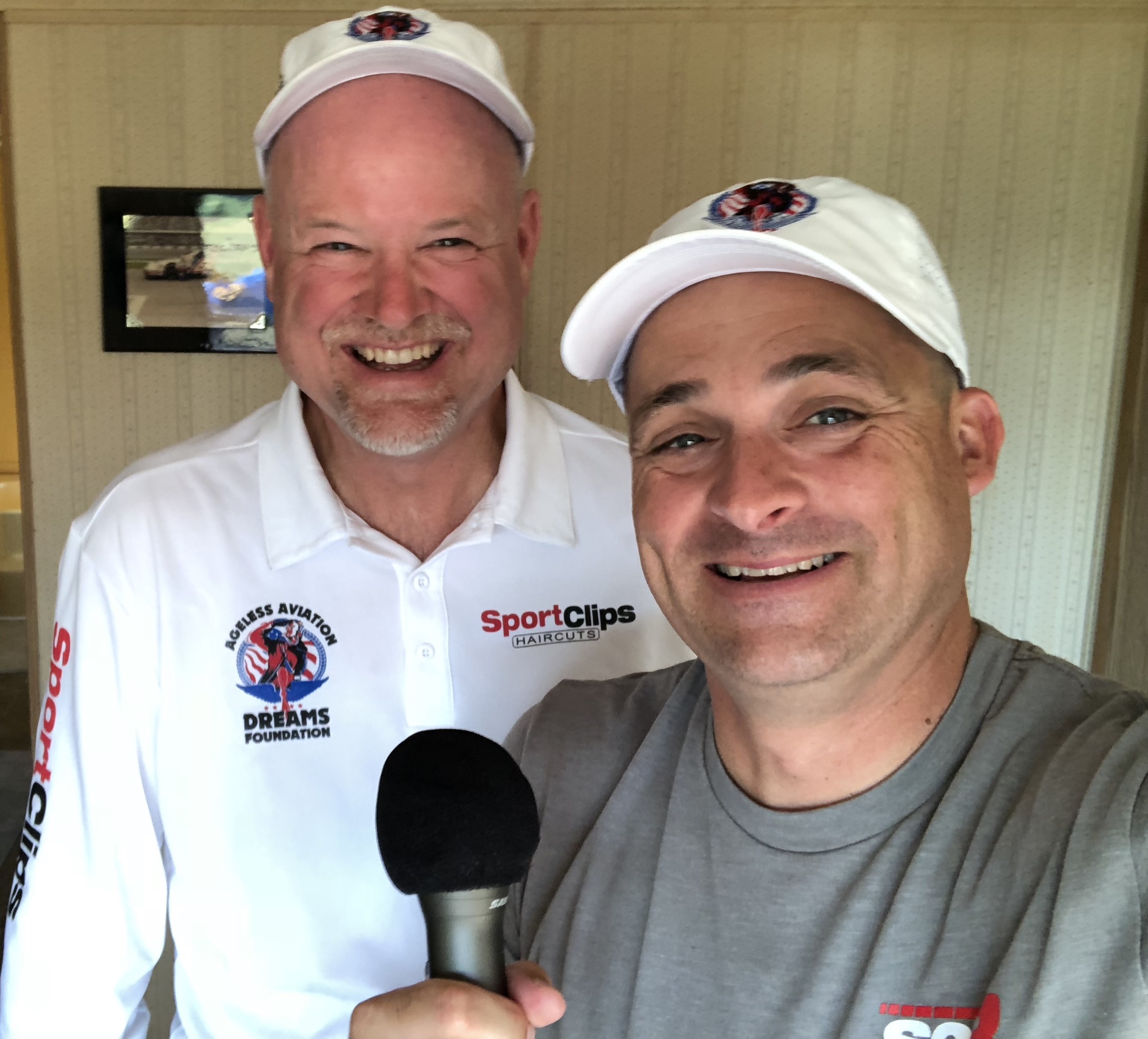 Chad with Darryl from Ageless Aviation holding a microphone